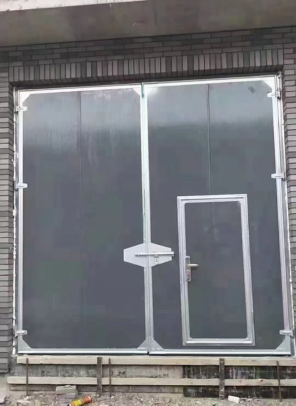 宝塔工业平开门在大型设备制造车间的应用实例